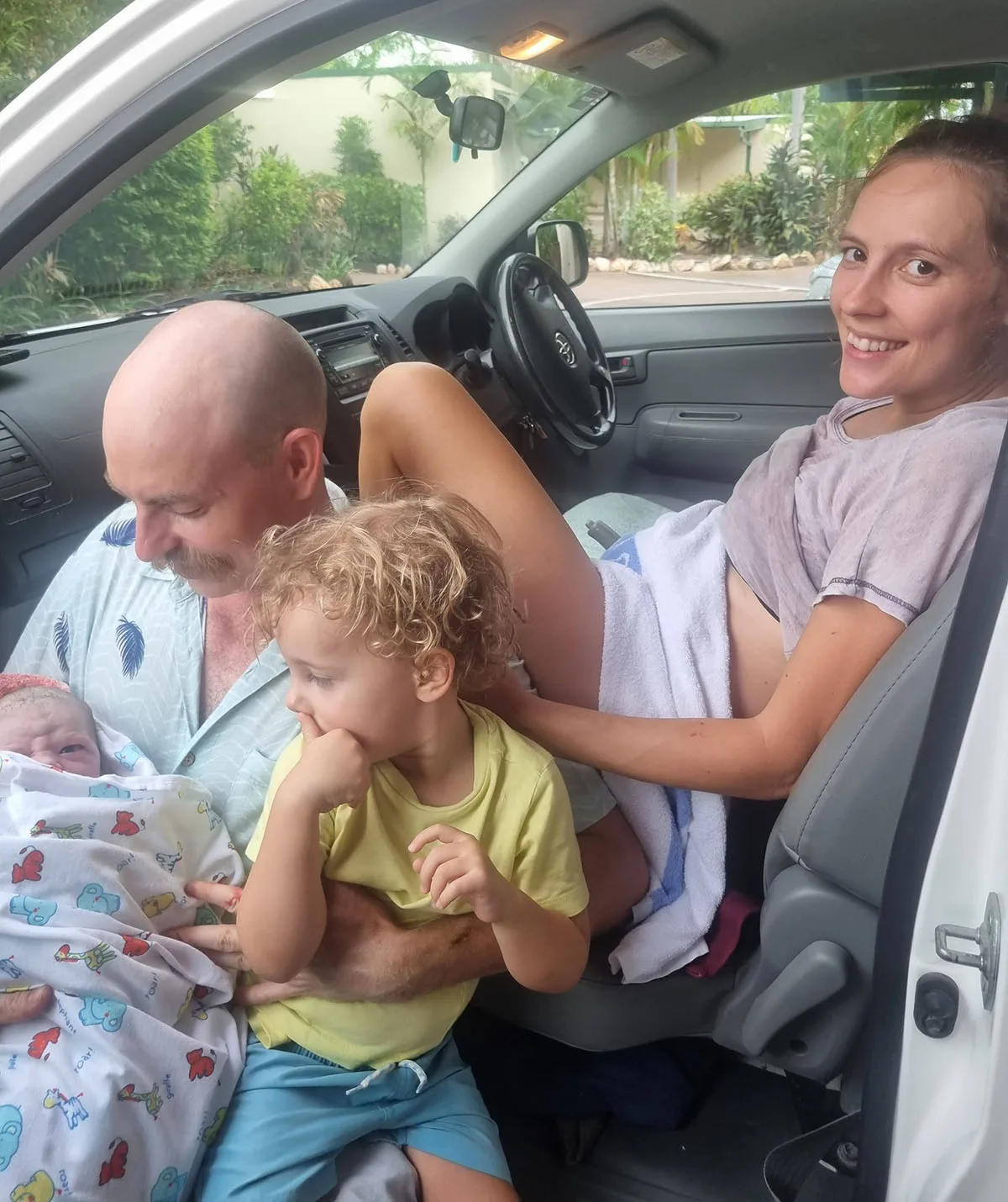 Me and the family after Dawn's birth in the Hilux. (Image: Supplied)