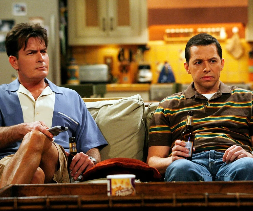 Two men sitting on a lounge