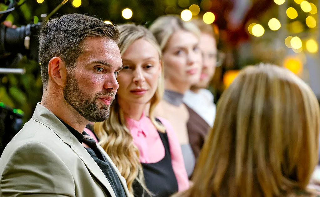 Michael and Rielli sit next to each other at an MKR instant restaurant, with Maria and Bailey next to them