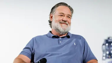 A man with a beard smiling