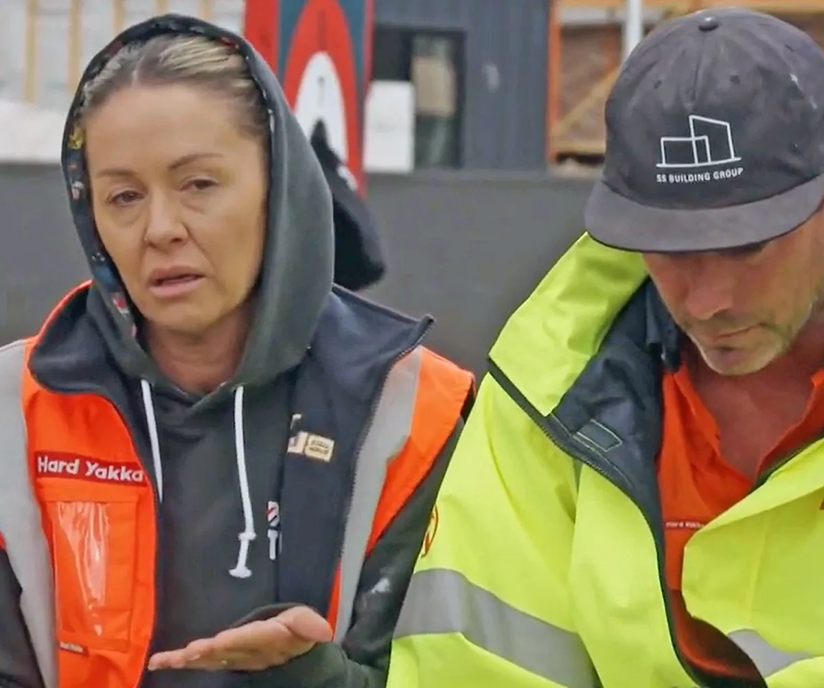 Alicia and Sonny in hi-vis looking upset at a body corporate on The Block 2025.