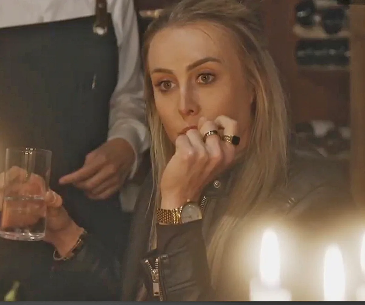 Han at the Lakehouse dinner on The Block with her head in hands looking upset.