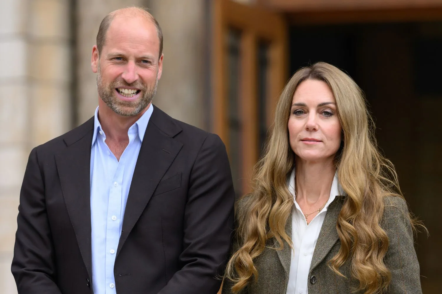 Kate, Princess of Wales, with blonder hair, stands next to Prince William