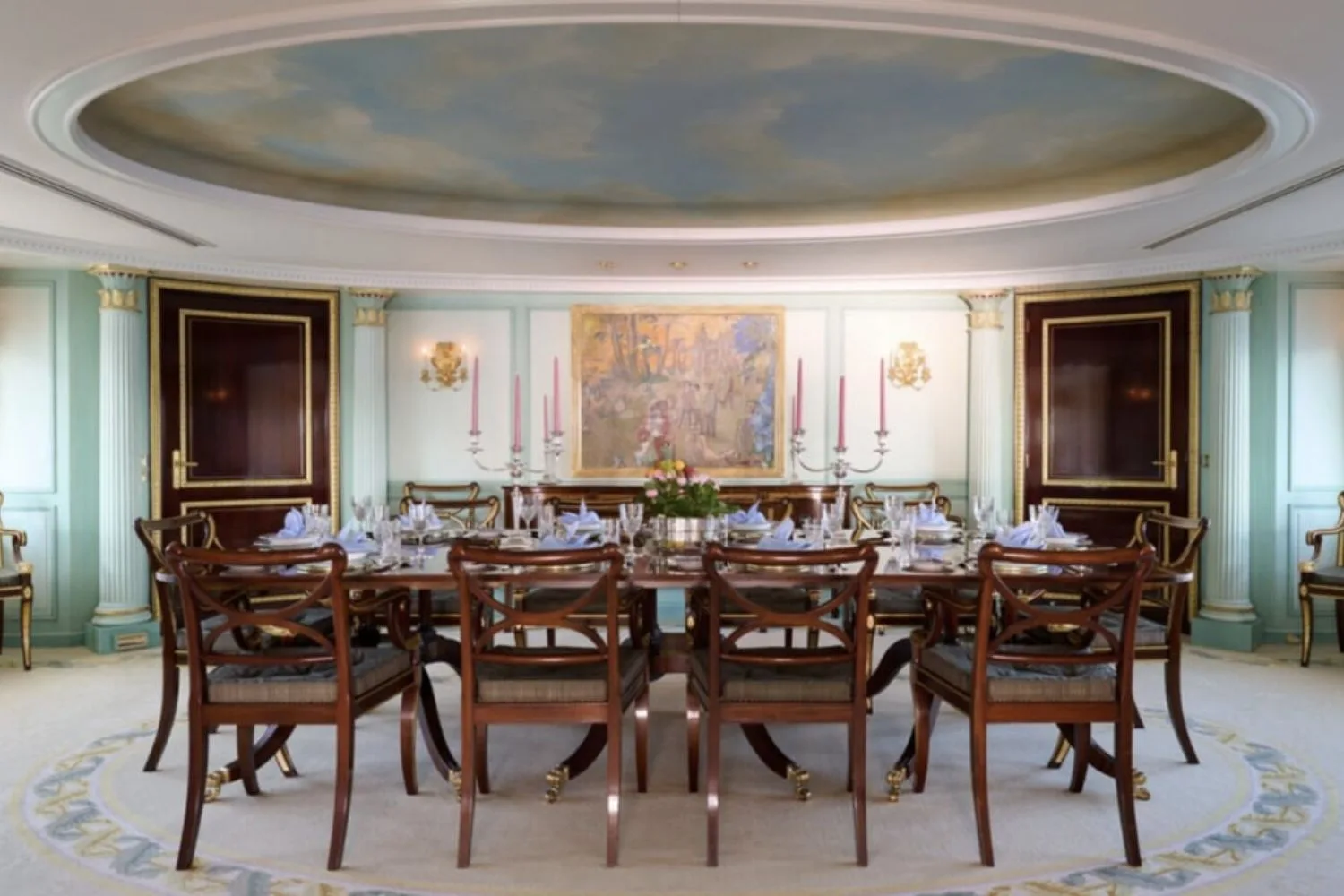 The dining room on The Lady Beatrice with a fresco in the ceiling