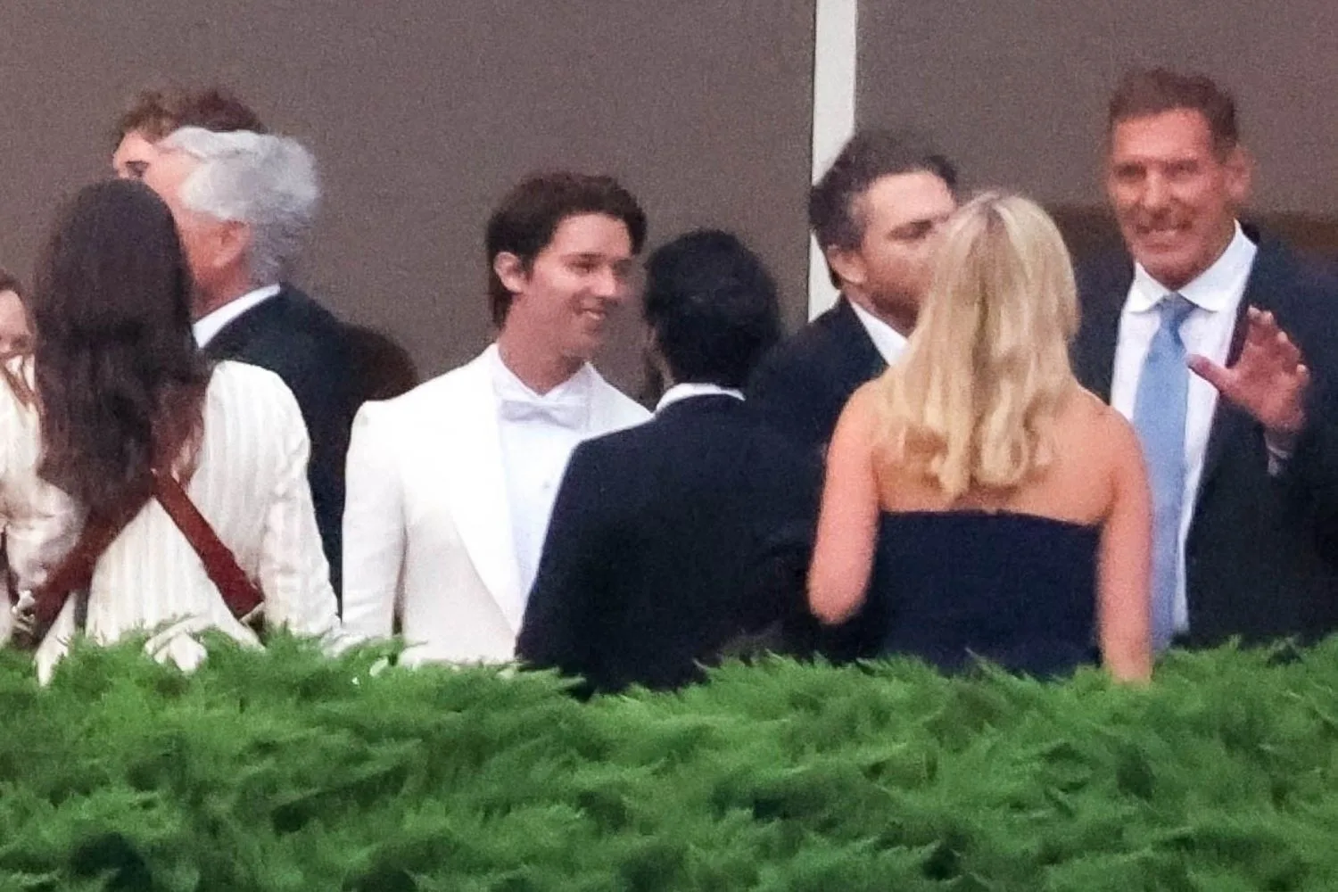 White Lotus star Patrick Schwarzenegger chats to guests at his wedding