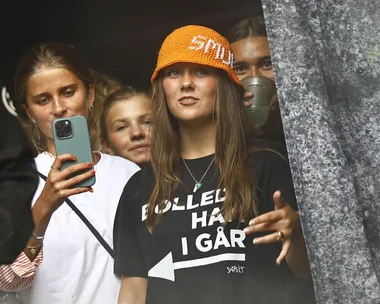 Queen Mary, left, and her daughter Isabella in her X-rated t-shirt, right