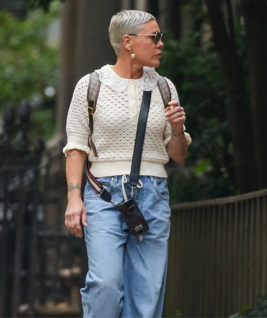A woman walks along a street.