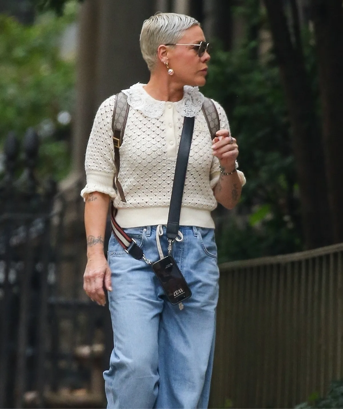 A woman walks along a street.