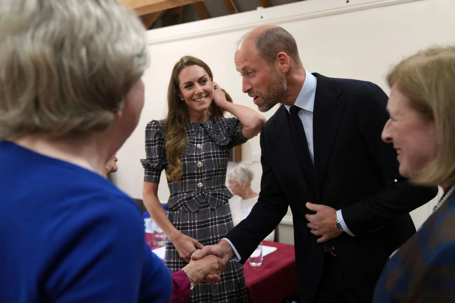 Prince William and Kate, Princess of Wales speak to workers at the National Federation of Women's Institute 