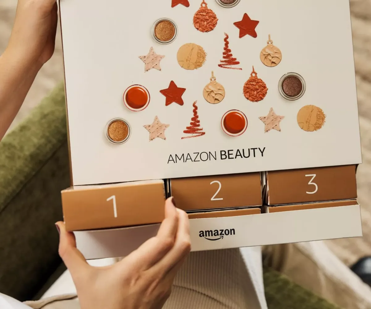 woman's hand opening Amazon Advent Calendar 