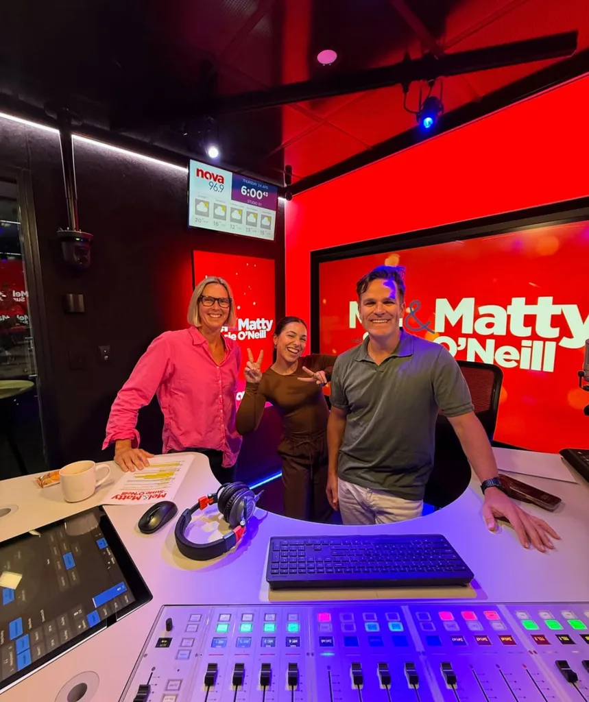 Mel Tracina, host of Big Brother 2025, also hosts a show on radio network Nova. Image of her in the studio.