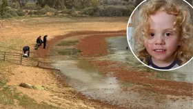 Gus Lamont and police divers searching a dam