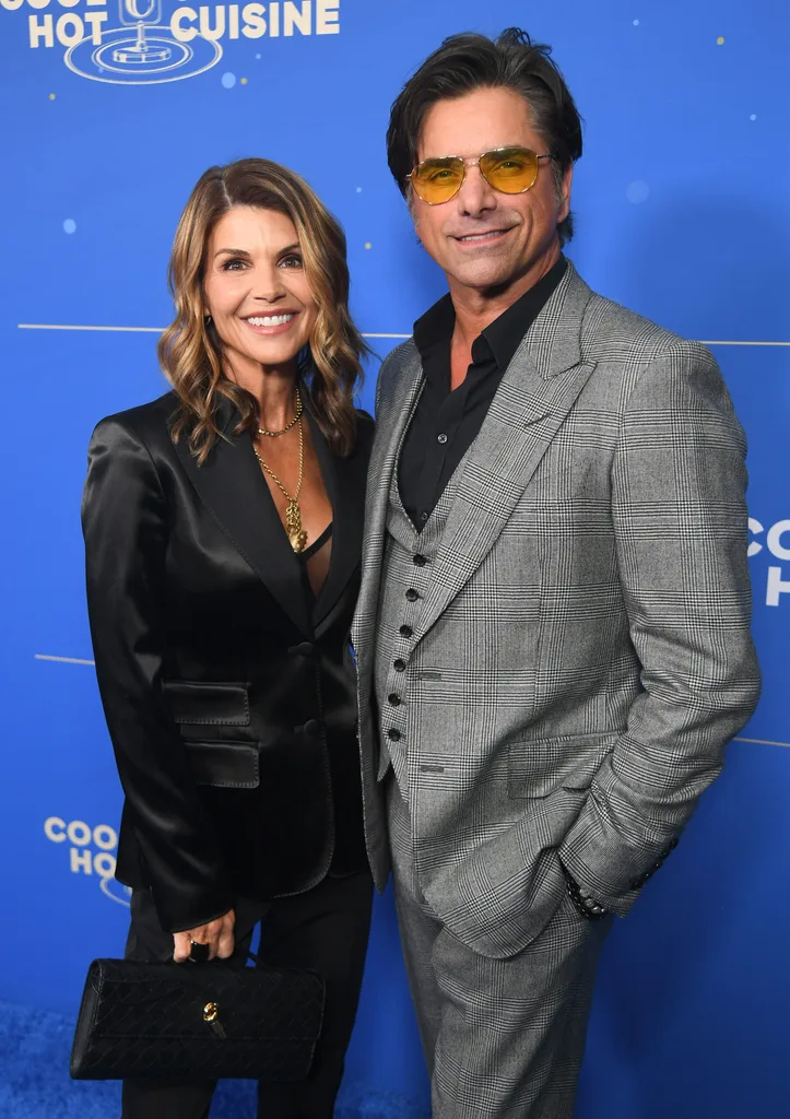 Lori Loughlin and John Stamos attend Cool Comedy Hot Cuisine Benefitting The Scleroderma Research Foundation at Fairmont Century Plaza on October 29, 2024 in Los Angeles, California.