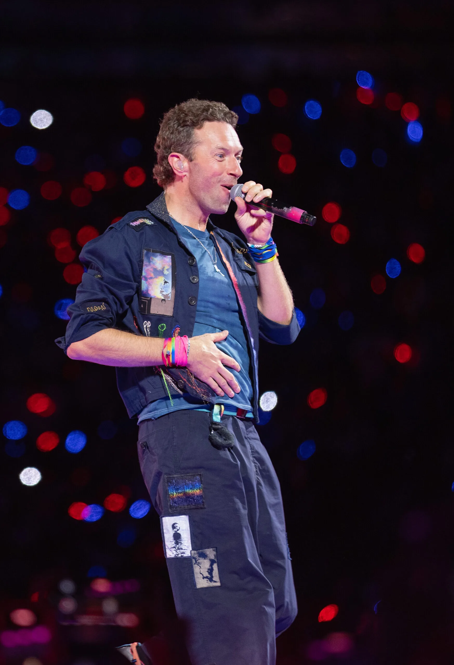 Chris Martin of Coldplay performs onstage during a concert at Wembley Stadium
