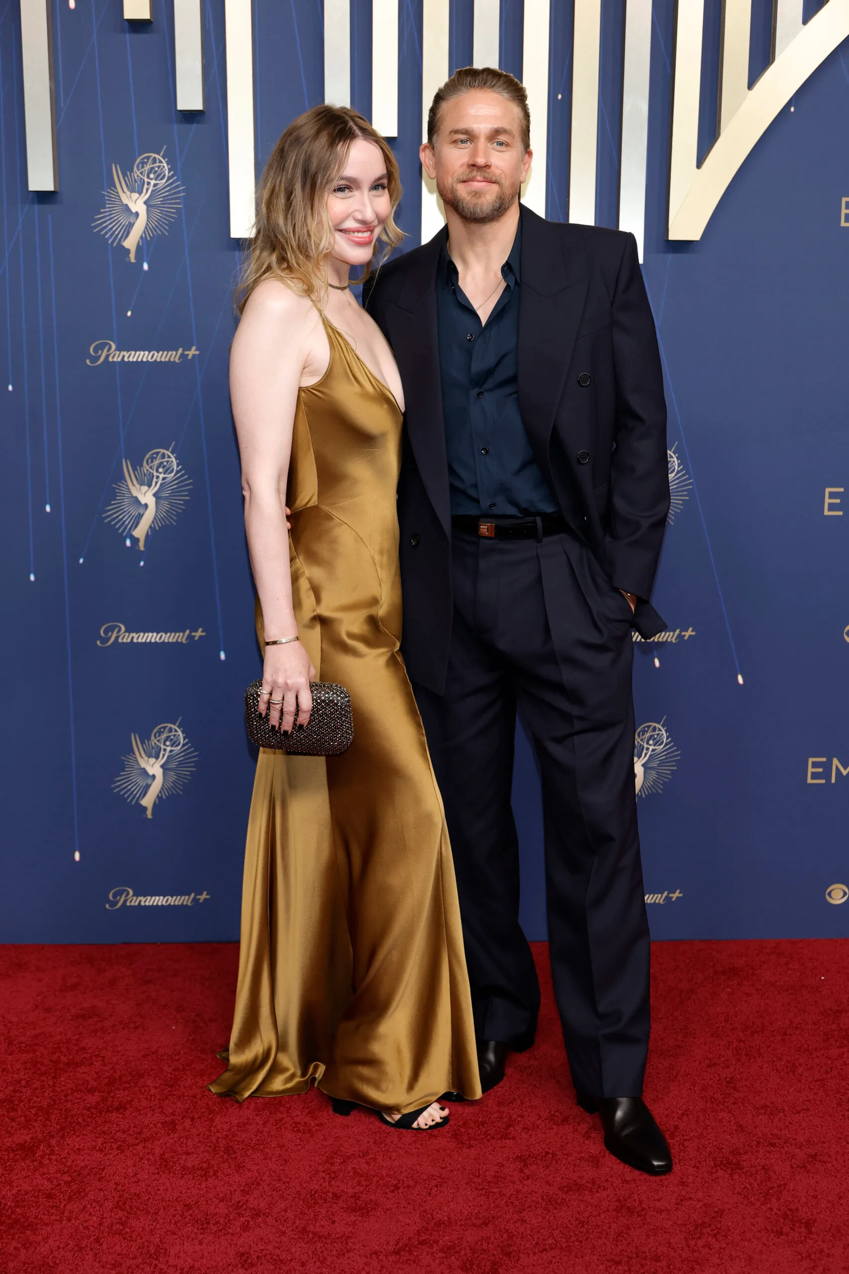 Morgana McNelis and Charlie Hunnam attend the 77th Primetime Emmy Awards at Peacock Theater on September 14, 2025 in Los Angeles, California. 