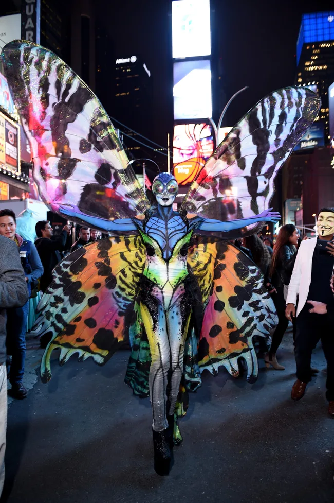 Heidi Klum gives Times Square visitors a sneak peek of her Halloween costume before hosting her annual party at TAO Downtown sponsored Bby Moto X on October 31, 2014 in New York City.