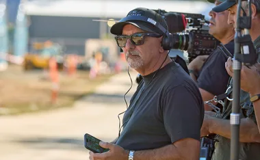 Julian Cress The Block creator standing with camera equipment on set of The Block.