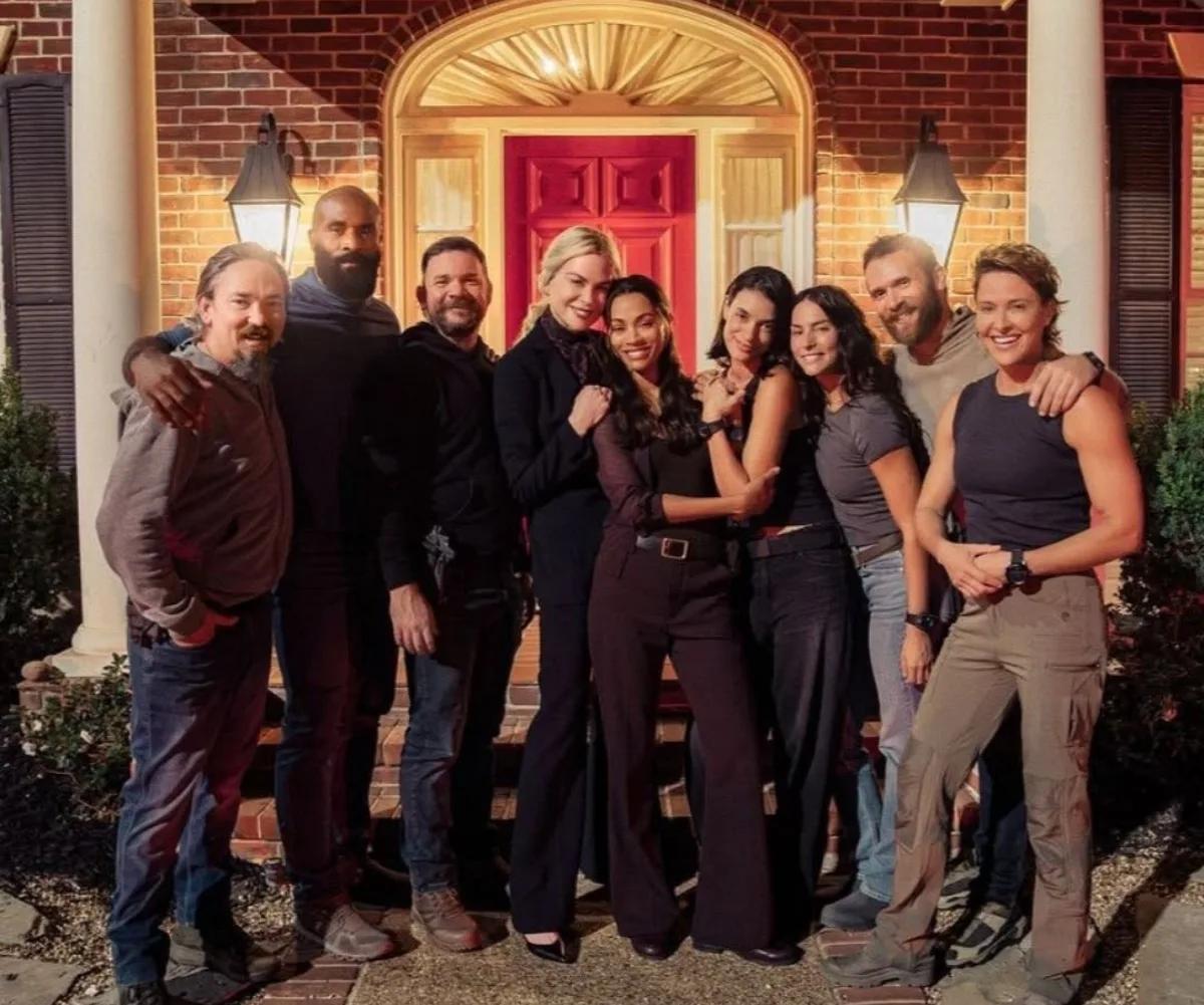 A group picture of men and women smiling.