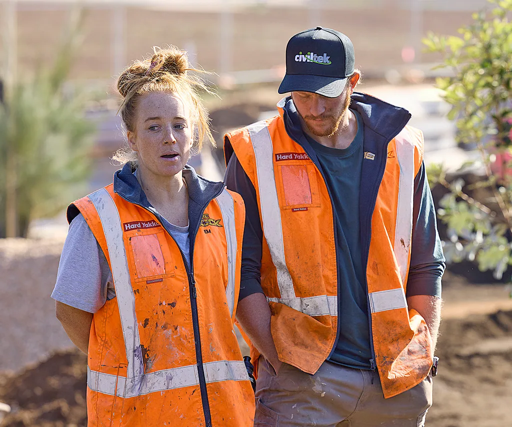 Emma and Ben in hi-vis on site of The Block 2025.