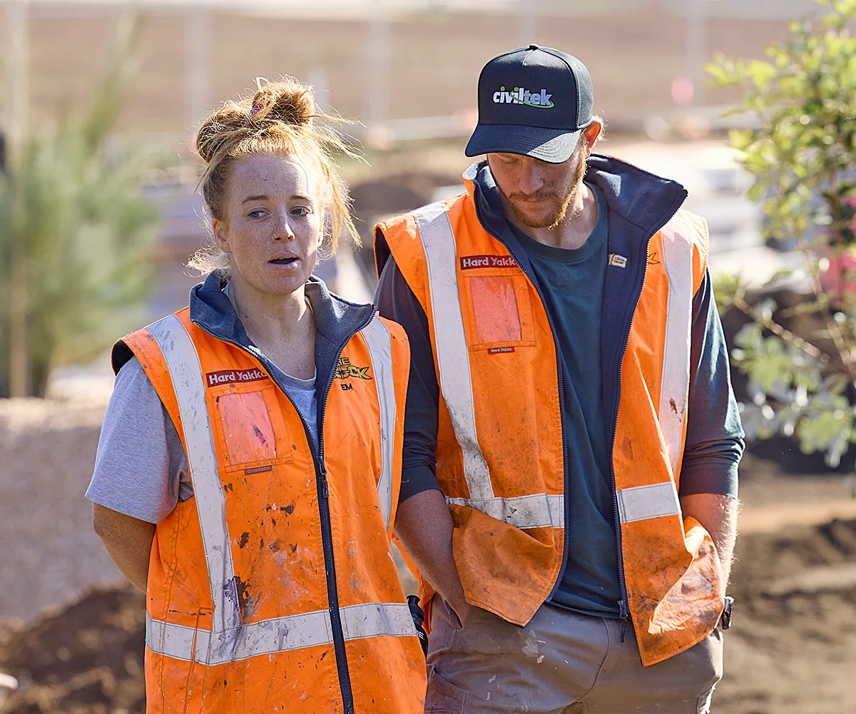 Emma and Ben in hi-vis on site of The Block 2025.