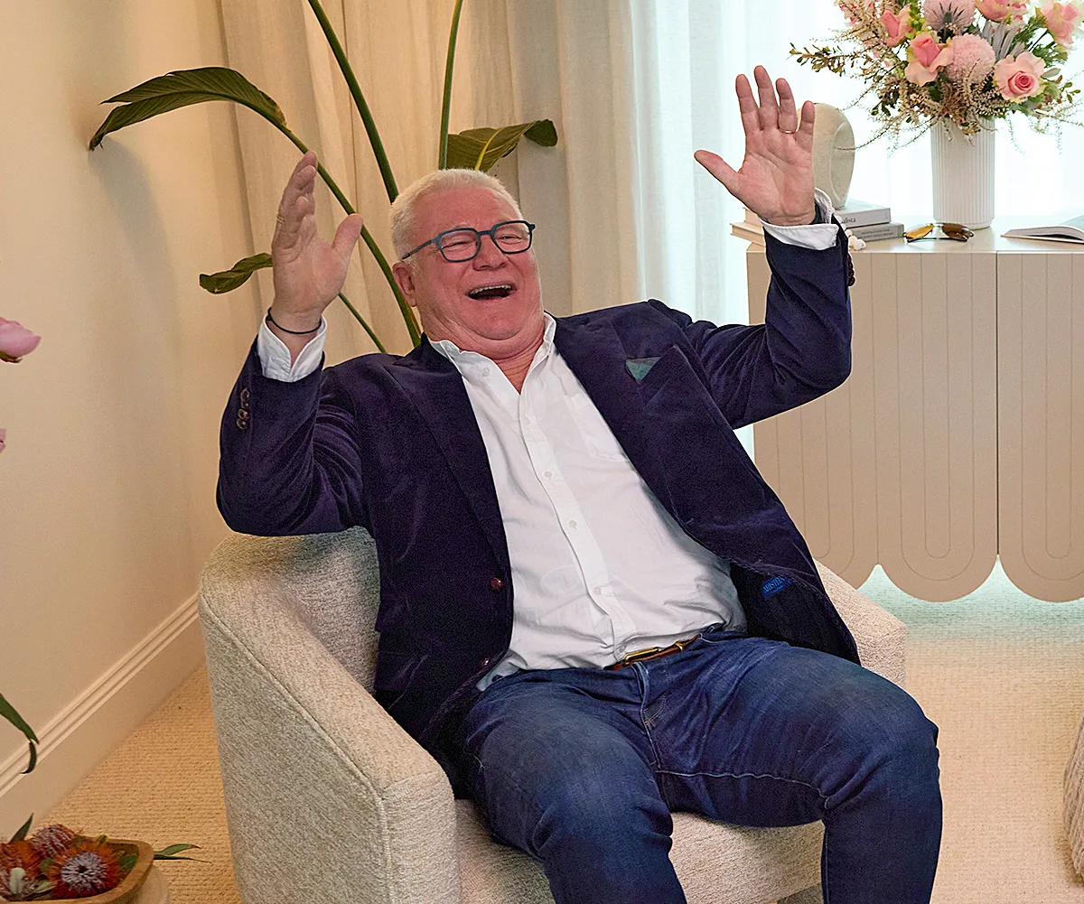 Scott Cam in the auction room of The Block celebrating a win.