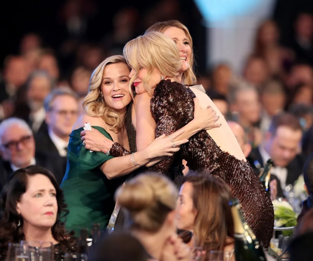 Nicole Kidman hugging Reese Witherspoon and Laura Dern.