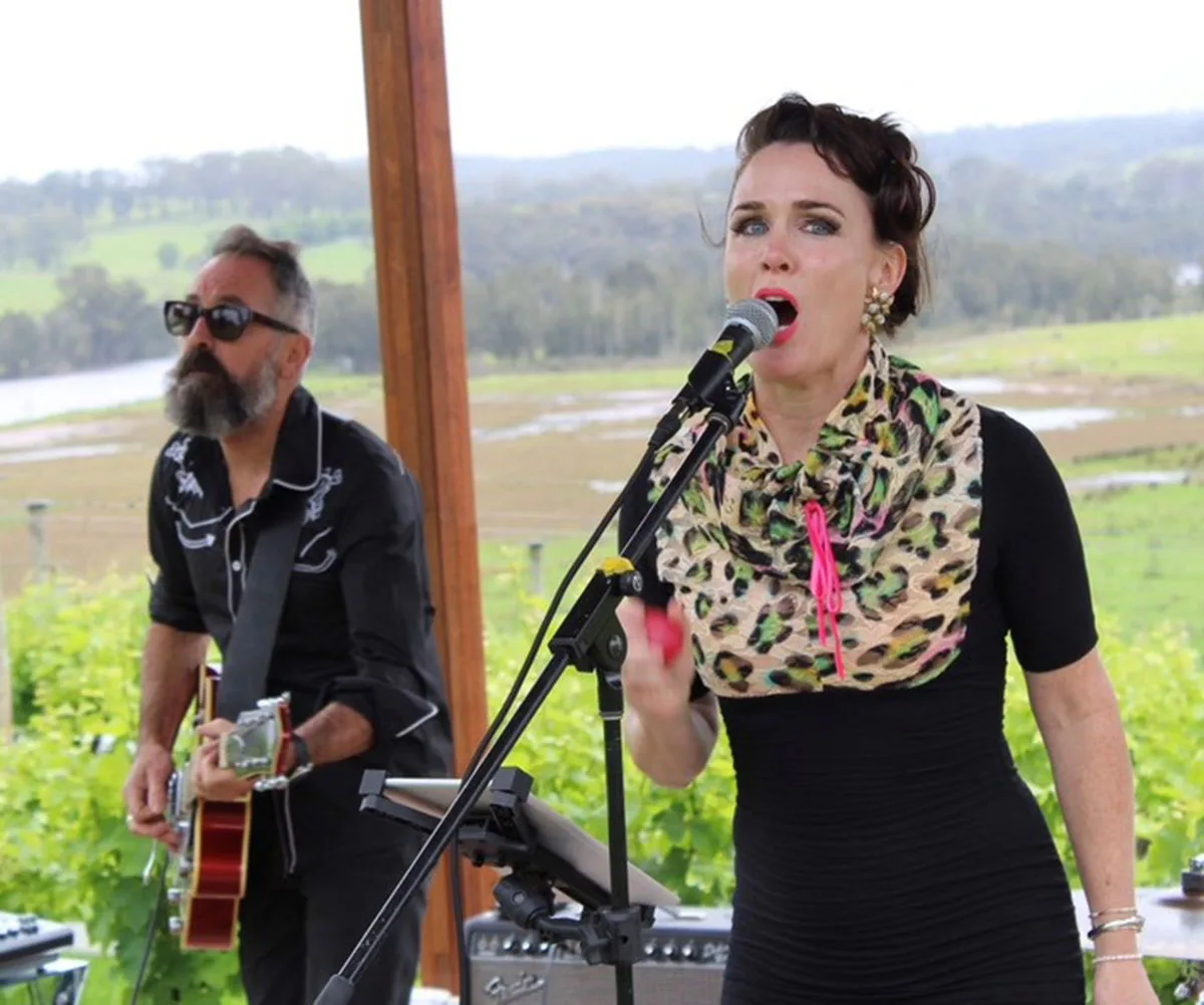 Greg and I performing with the band. (Image: Supplied)