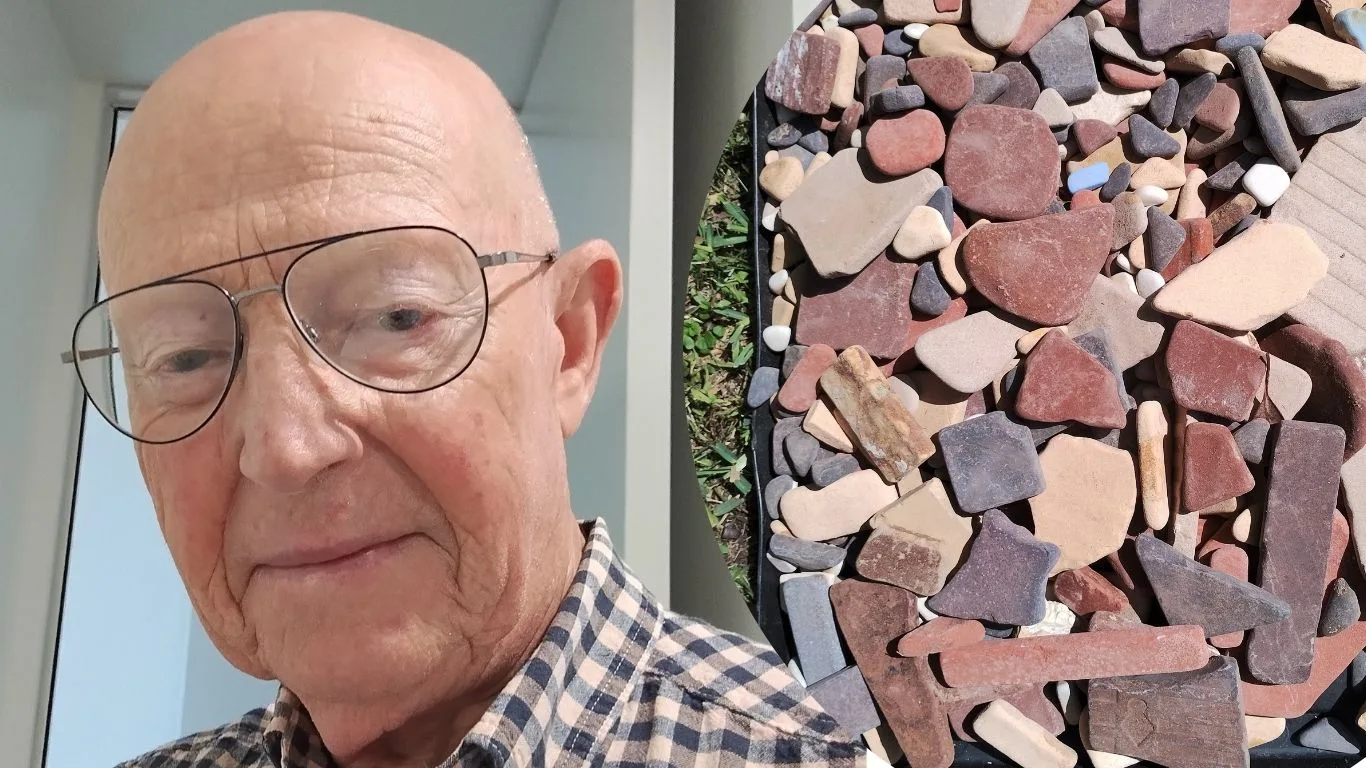 Allen Mawer and some of the Walter Hood tiles collected at Wreck Bay. (Image: Supplied)