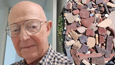 Allen Mawer and some of the Walter Hood tiles collected at Wreck Bay. (Image: Supplied)