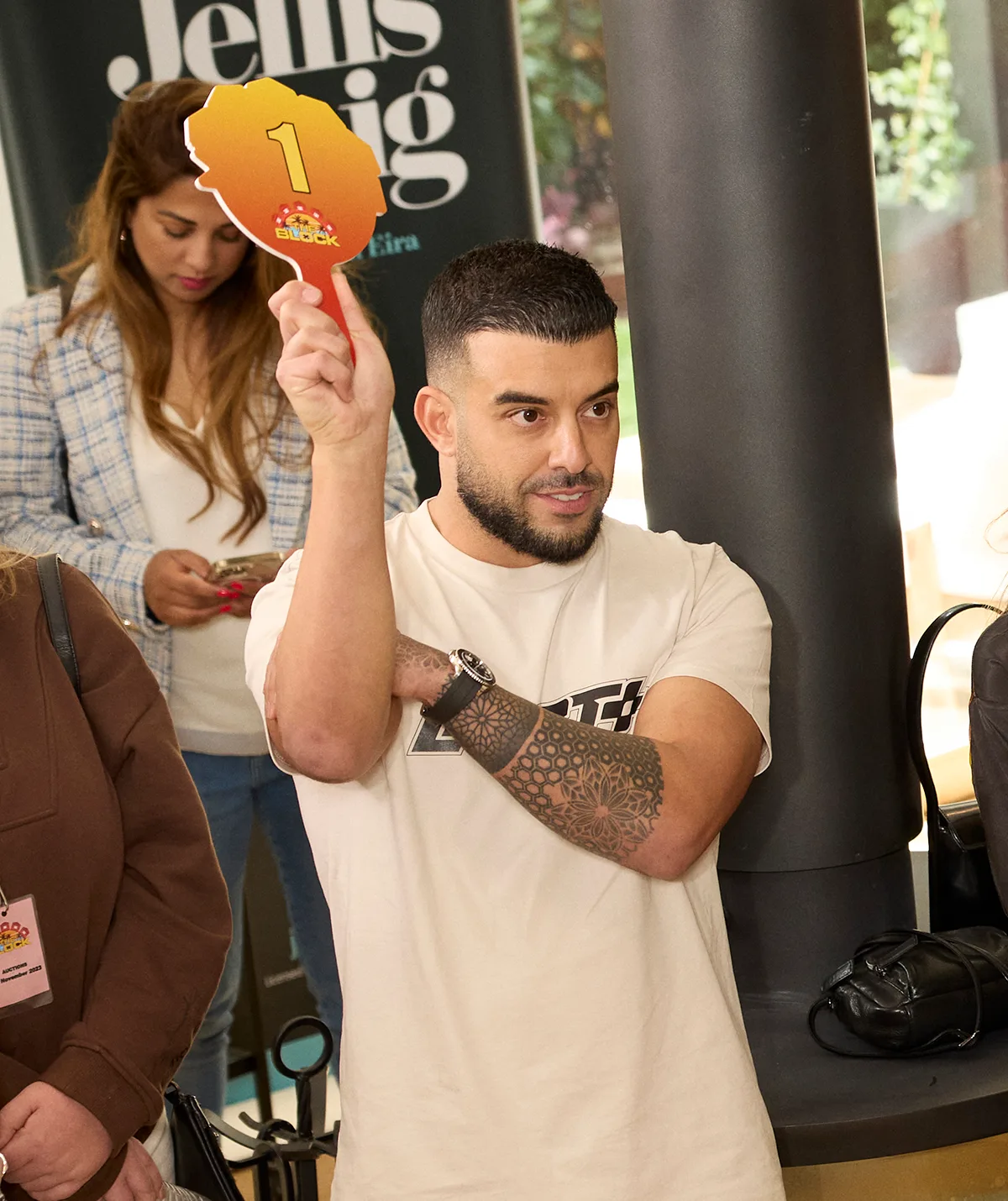 Adrian Portelli bidding at a Block auction.