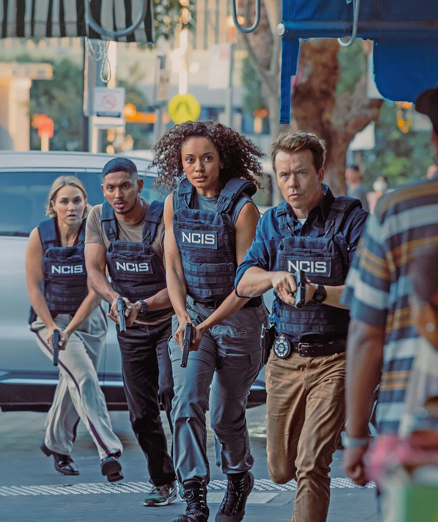 JD and Mackey race through the streets with bullet proof vests in season three of NCIS: Sydney.