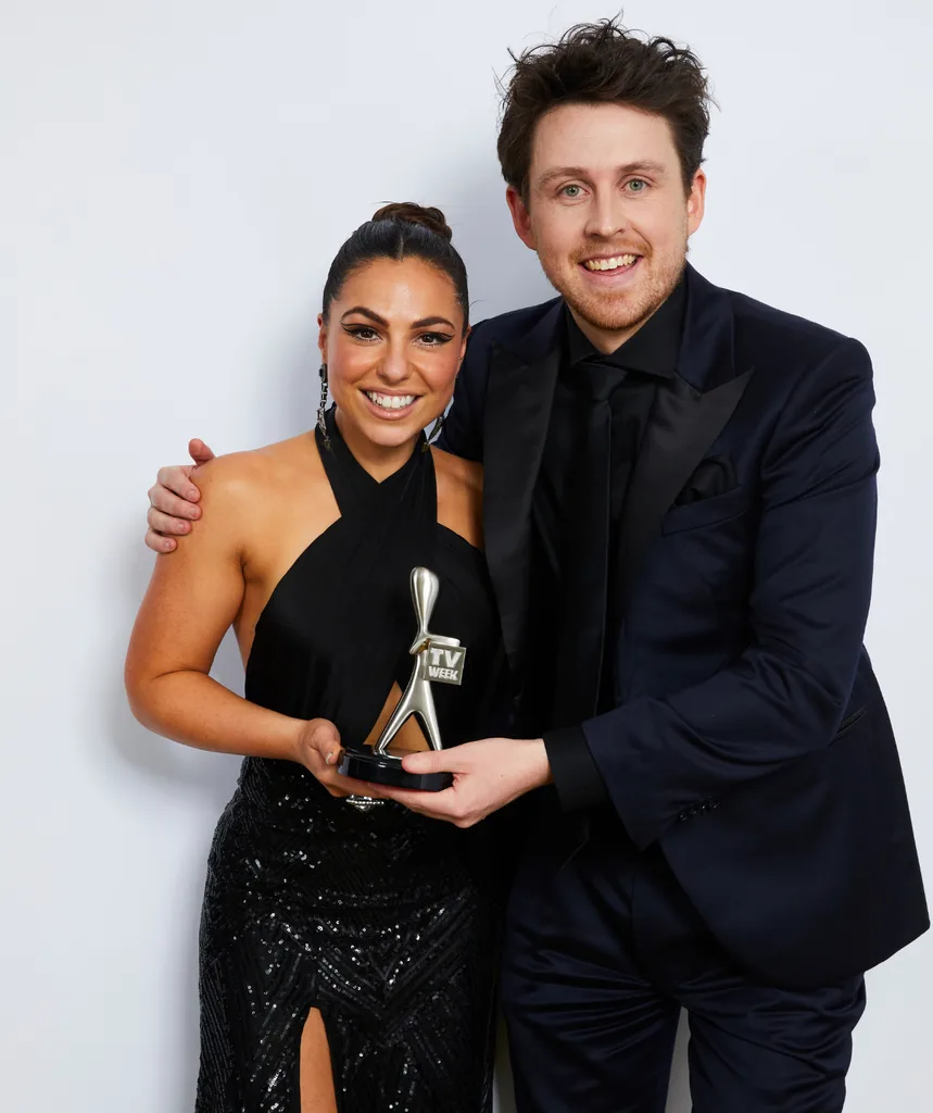Mel Tracina and Tim McDonald holding a Logie.
