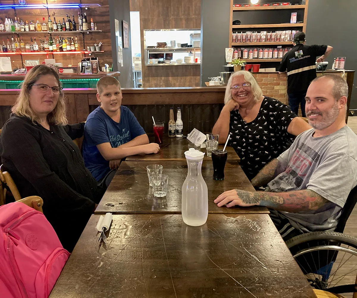 Me with our son Jeremy, Mirra and Chris out for dinner together. (Image: Supplied)