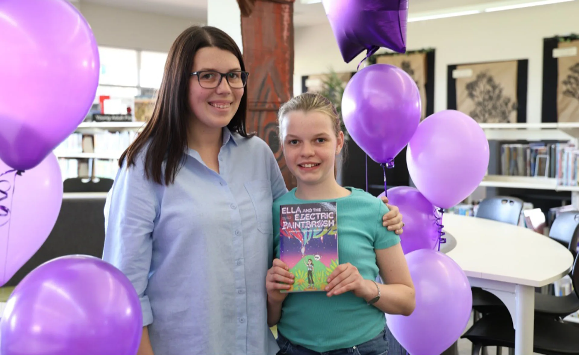 Katherine Cooper and daughter Ella Gray with her children's book. (Image: Supplied)