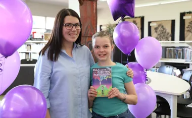 Katherine Cooper and daughter Ella Gray with her children's book. (Image: Supplied)