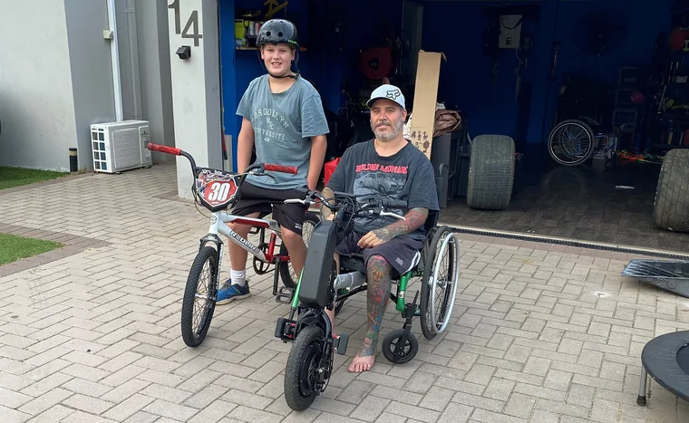 Chris and his son Jeremy. (Image: Supplied)