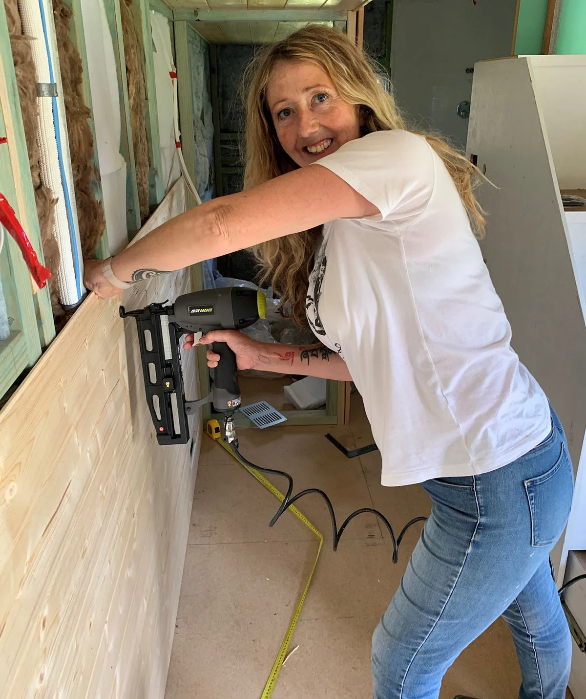 Me installing the internal walls of my Tiny House. (Image: Supplied)