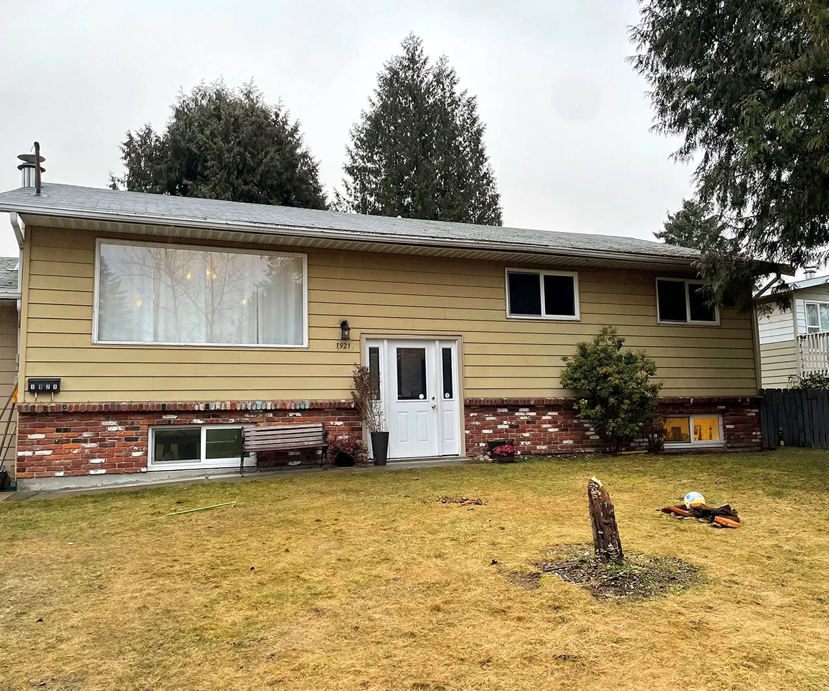 The shared house and Kelly and I live with our kids. (Image: Supplied)