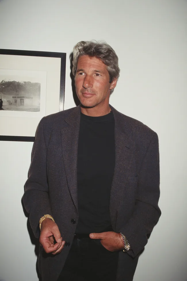 Richard Gere in front of his Tibetan photo, circa 1998.