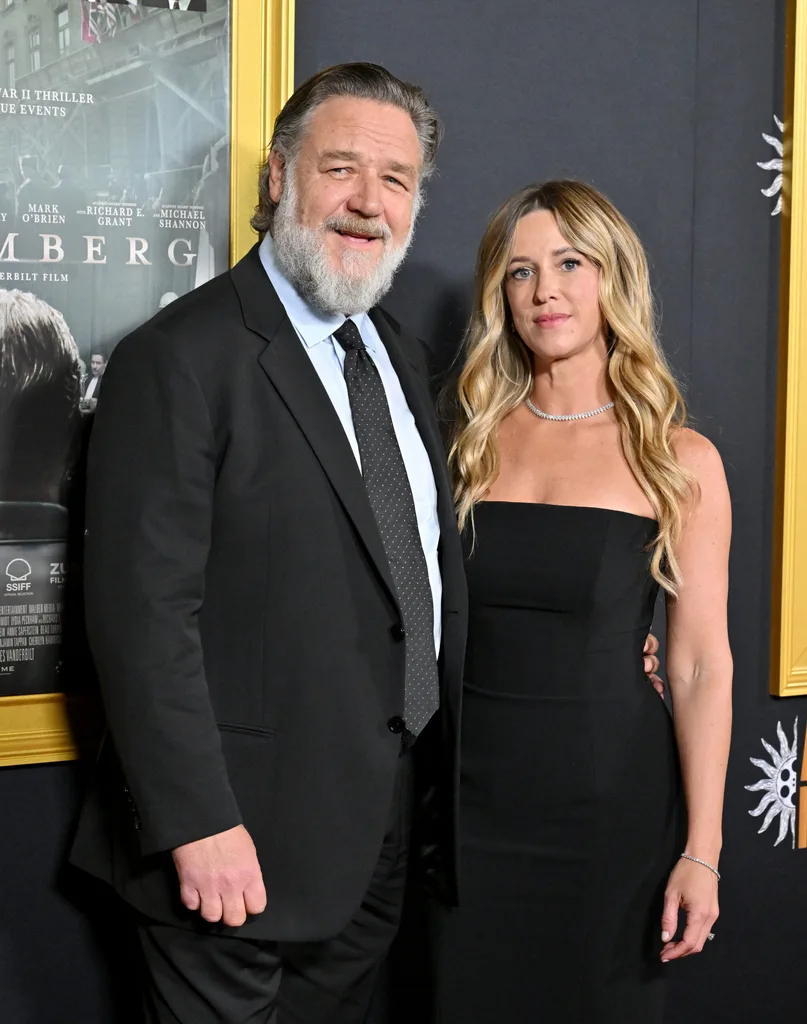Russell Crowe and Britney Theriot attend the 2025 AFI FEST - "Nuremberg" Premiere at TCL Chinese Theater on October 24, 2025 in Hollywood, California.