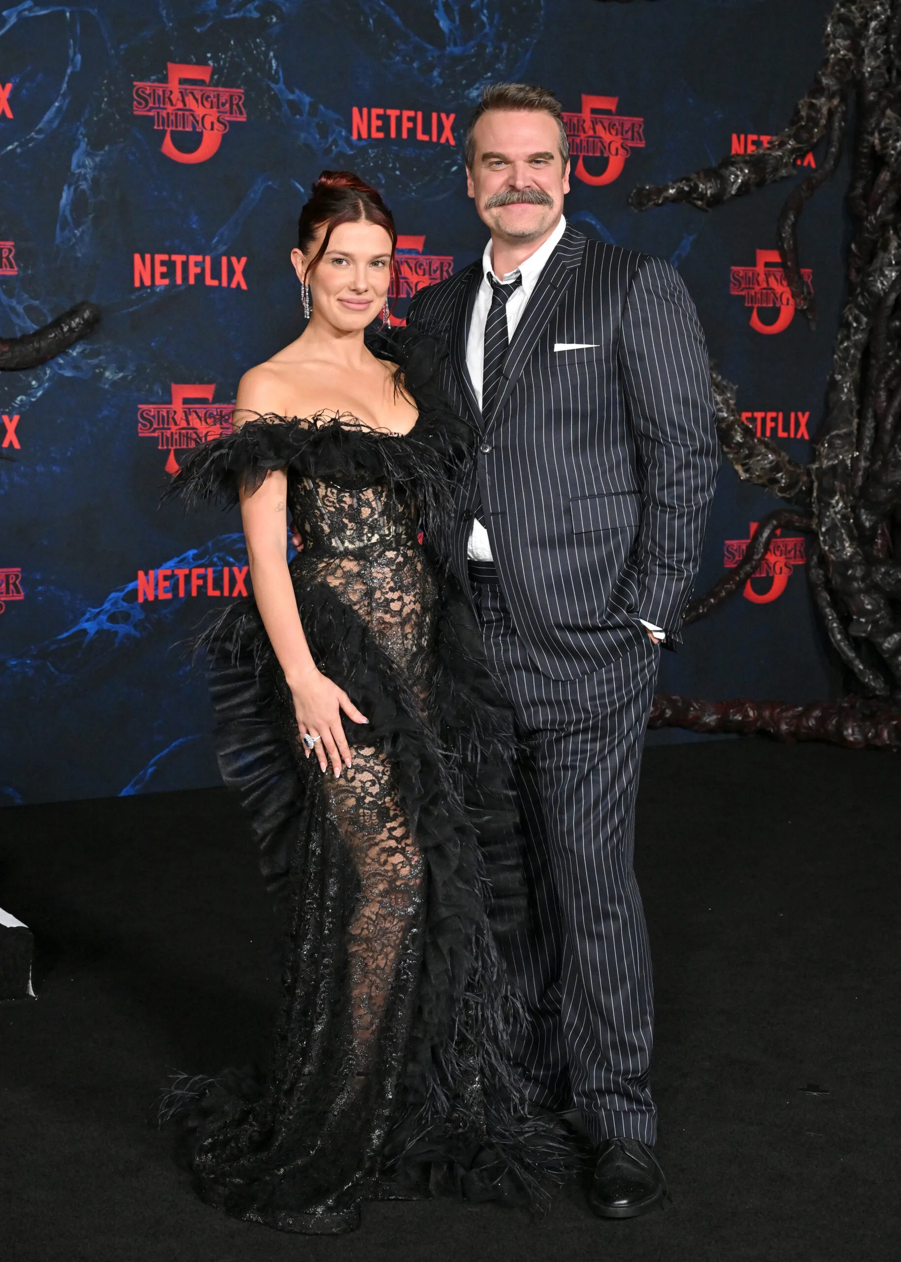 Millie Bobby Brown and David Harbour attend the Los Angeles Premiere of Netflix's "Stranger Things" Season 5 at TCL Chinese Theatre on November 06, 2025 in Hollywood, California. 