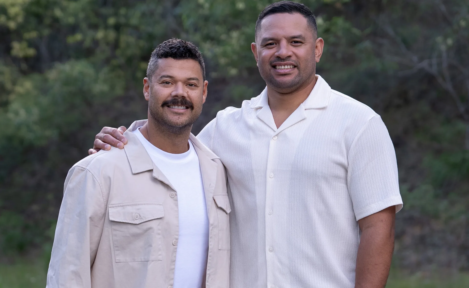 Will stands with his arm around Justin