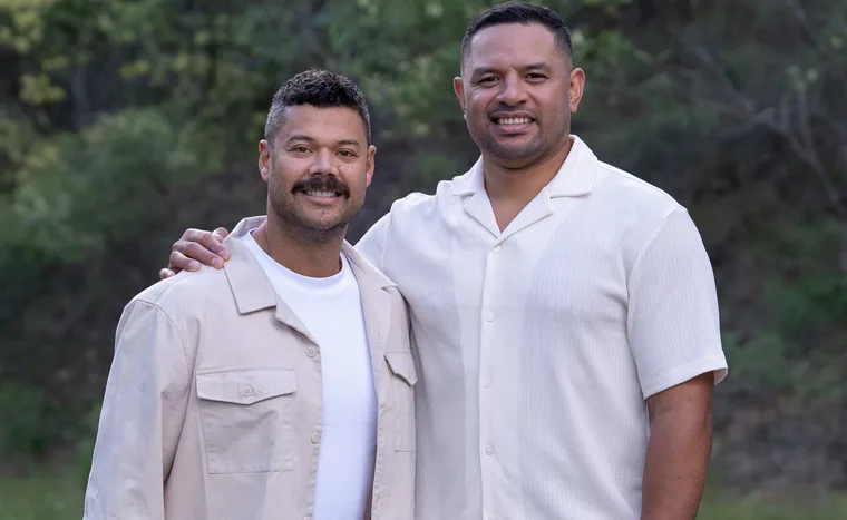 Will stands with his arm around Justin