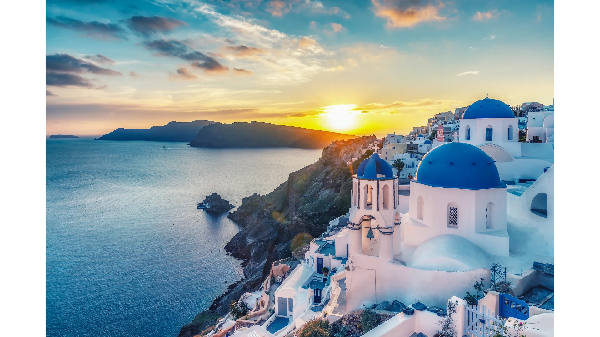The sun sets over Santorini.