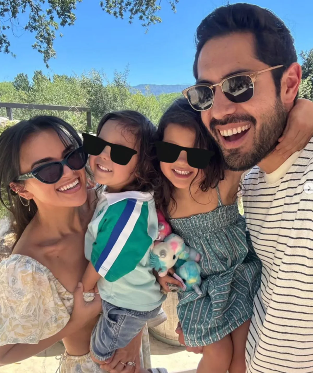 Fely, the kids and Tai smile for a family pic!