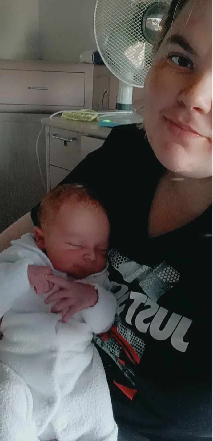 Me with my son James just after he was born. (Image: Supplied)