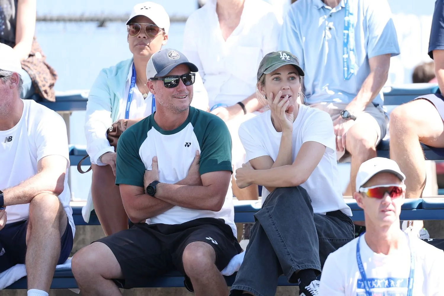 Bec and Lleyton Hewitt watching a tennis match