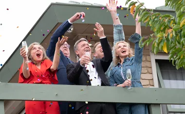 Neighbours cast cheering on the street with champagne in hand in the 2022 series finale.