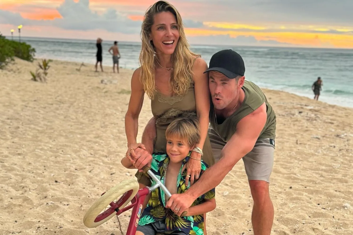 Chris Hemsworth and Elsa Pataky on the beach with one of their sons