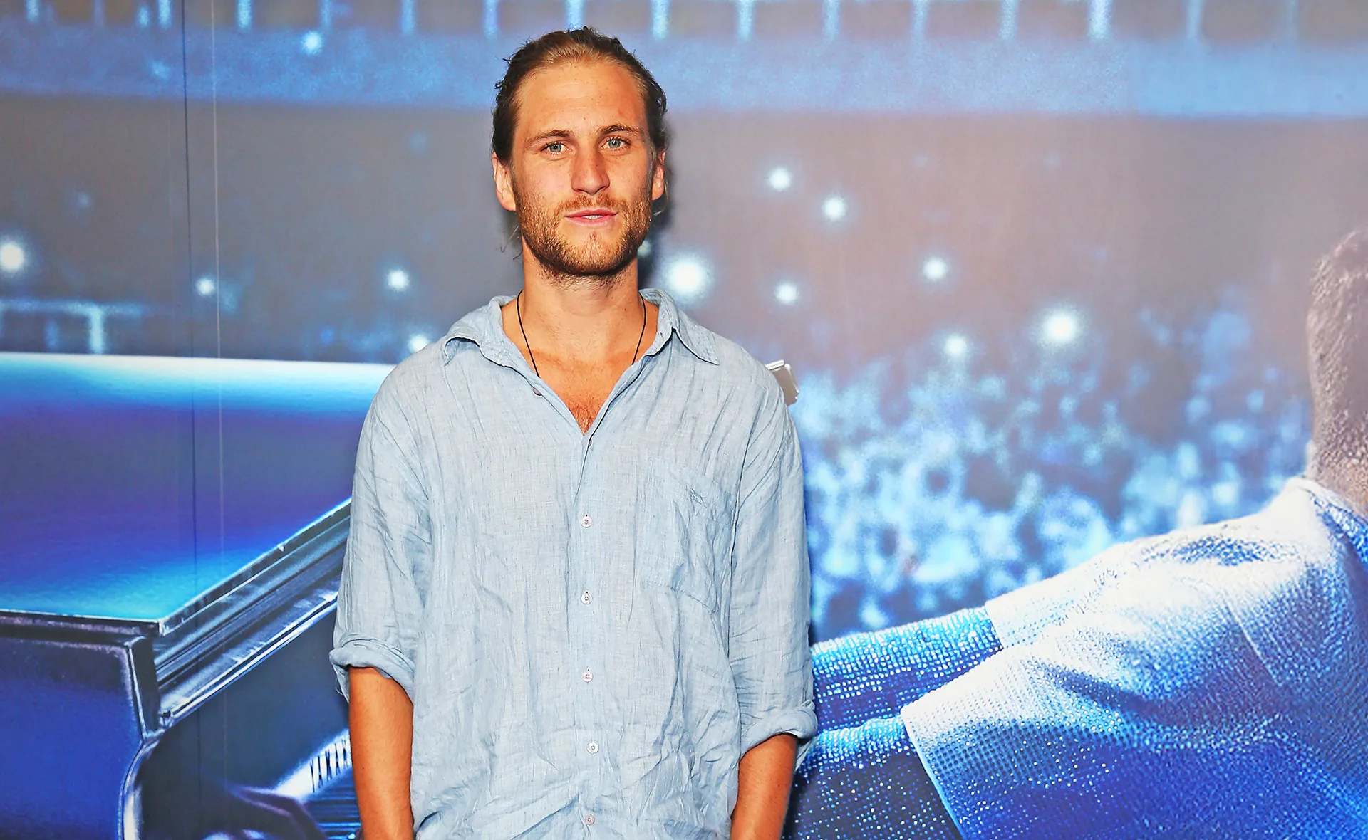 George Mason, wearing a blue shirt